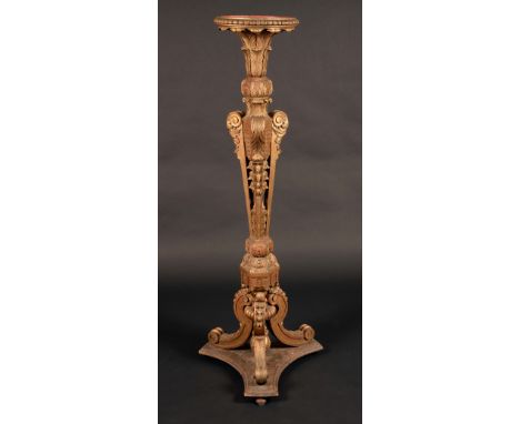 A 19th century giltwood torchere, influenced by the designs of William Kent, dished circular plateau with dart-and-egg frieze