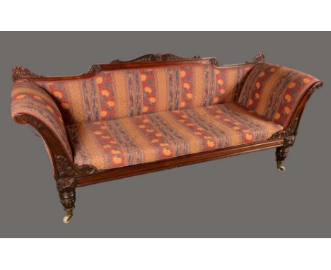 A post-Regency rosewood sofa, shaped cresting rail and scroll ends carved with acanthus, stuffed-over upholstery, turned and 