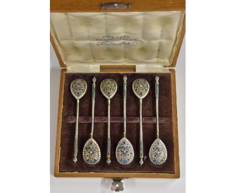A set of six Russian silver and cloisonne enamel coffee spoons, each decorated in polychrome with stylised leaves and scrolls
