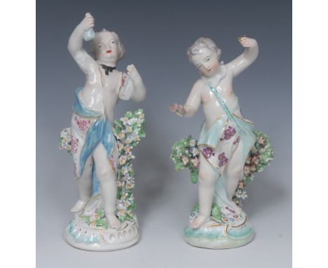A pair of  Derby Patch Mark figures, of Cupids, scantilly draped, before bocage, one holding a money bag, the other birds, sc