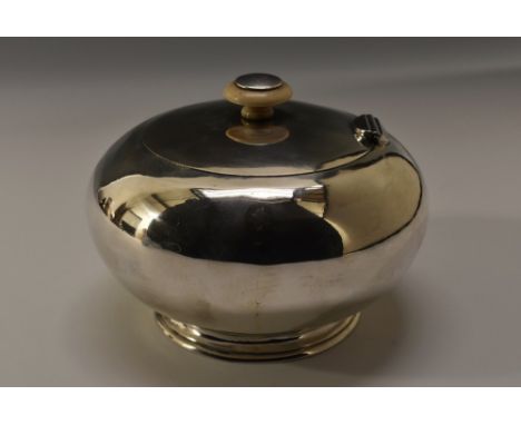A 19th century Russian silver bun shaped tea caddy, quite plain, knop finial, hinged cover, skirted base, gilt interior, 13.5
