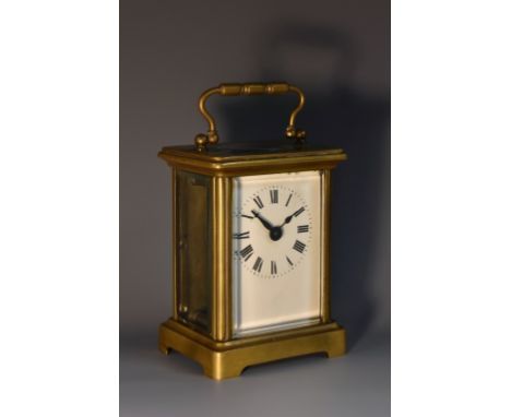 An early 20th century French lacquered brass carriage timepiece, 5.5cm rectangular enamel dial inscribed with Roman numerals,