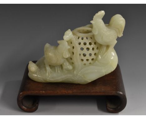 A Chinese jade group, of a cockerel, hen and chicks, by a basket, 13.5cm wide