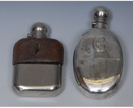 A Victorian silver hip flask, detachable base, bayonet domed hinged cover, 14.5cm high, London 1898;  another, plated (2)