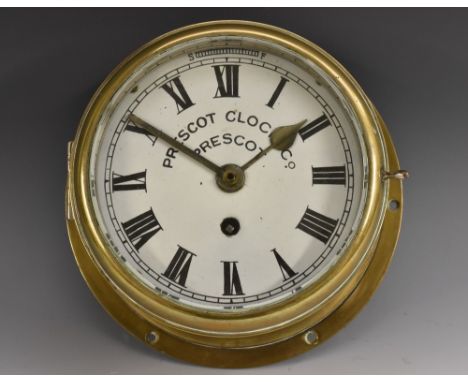 A Prescot Clock Company circular brass  marine timepiece, enamel dial, Roman numerals, slow/fast scale and single winding hol