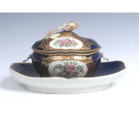 A Worcester quatrelobed dessert tureen, cover and stand, shell handles, painted with colourful flowers and foliage in gilt ca