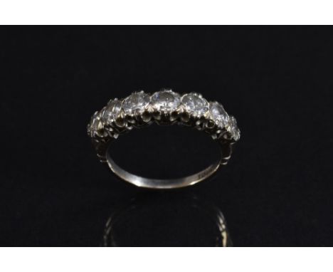 A half eternity ring, inset with seven round brilliant cut diamonds, total estimated diamond weigh approx 1.5 ct, 18ct white 