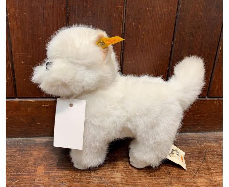 A modern Steiff ?Whitey? West Highland terrier with original ear button and paper label, length 9?