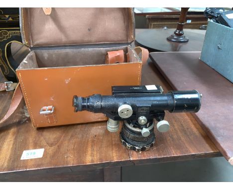 An early mid 20th century japanned theodolite by Entwistle Thorpe &amp; Co in leather case;A drainage/water leveling kit; A v
