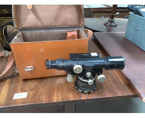 An early mid 20th century japanned theodolite by Entwistle Thorpe &amp; Co in leather case;A drainage/water leveling kit; A v