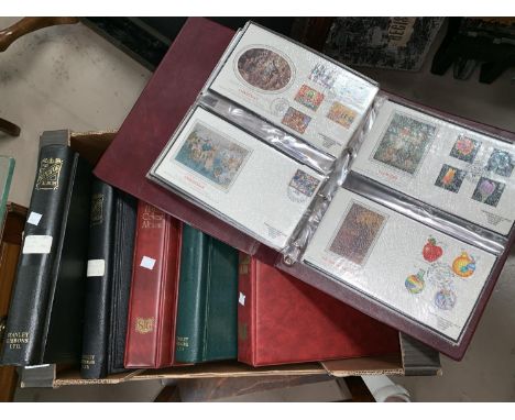 A collection of stamps and first day covers in albums. 