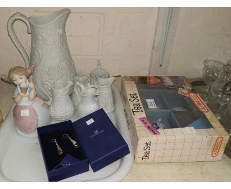 A collection of 6 Portmeirion bisque jugs; a boxed doll's tea set; a Nao figure; a boxed pair of Swarovski earrings; a signed