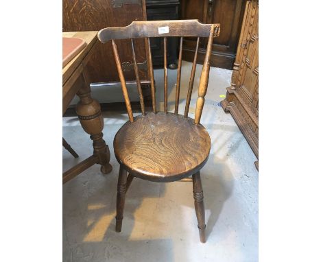 A set of 4 elm stick back kitchen chairs 