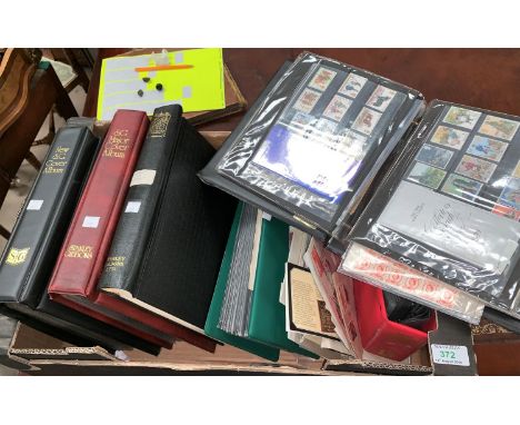 A collection of stamps and first day covers in albums 