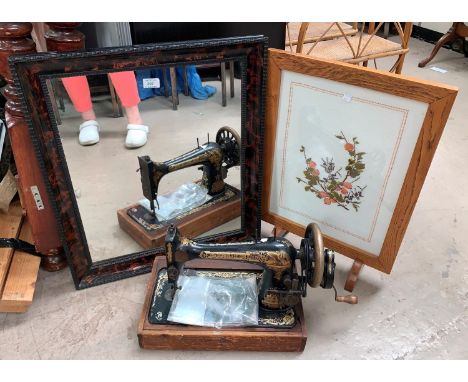 A Singer hand operated sewing machine; a 19th century mirror with tortoiseshell frame, another mirror and a needlework firesc