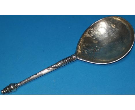 A white metal possibly 17th / 18th century teardrop shaped anointing spoon, , with archtectural engraved decoration lettered 