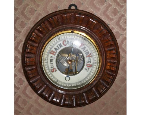 A mahogany cased aneroid barometer 