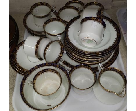An early 20th century Diamond China part tea service with blue and gilt decoration 