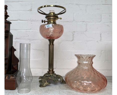 A Victorian style brass and pink glass oil lamp 