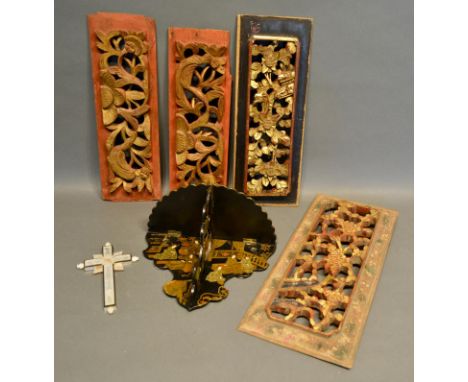 A Japanese Lacquered Wall Bracket, together with a mother of pearl crucifix and four carved Chinese pierced panels 