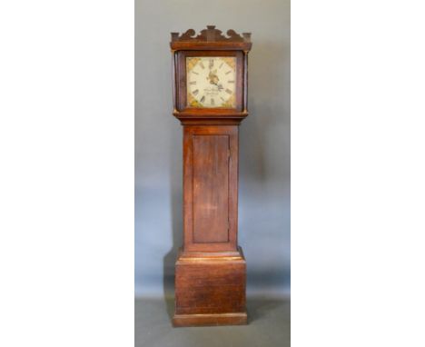 A George III Oak Longcase Clock, the painted dial inscribed Charles Hawke, Wickham, with a rectangualr door above a conformin