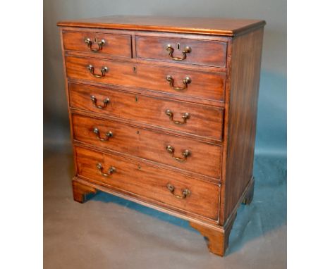 A 19th Century Mahogany Chest, the moulded top above two short and four long graduated drawers with brass handles raised upon