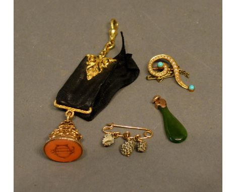 A 9 Carat Gold Seal Fob, together with two brooches and a small jade pendant 