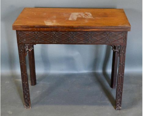 A 19th Century Mahogany Chippendale Style Card Table, the foldover top with baize lined interior and with carved blind fretwo