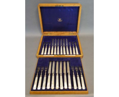 A Set of Twelve George V Silver and Mother of Pearl Handled Fruit Knives and Forks within fitted oak case in two layers, Lond
