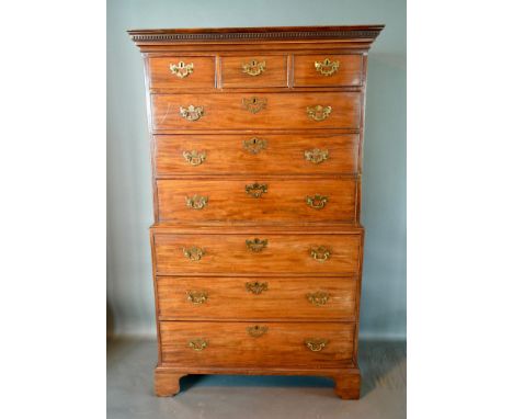 A George III Mahogany Chest on Chest, the moulded cornice above three short and six long graduated drawers with brass swan ne