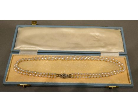 A Double Row Cultured Pearl Necklace, the platinum clasp set with diamonds 