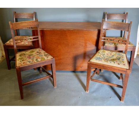 A 19th Century Mahogany Drop Flap Dining Table raised upon square tapering legs, together with a set of four rail back dining