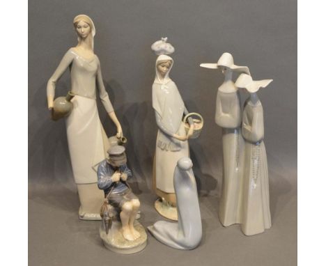 A Lladro Figurine of Two Nuns, together with two other Lladro figurines, a Royal Copenhagen figurine of a boy and a Rosal fig