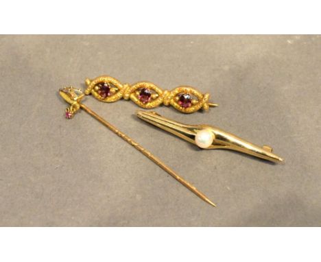 A 15 Carat Gold Triple Bar Brooch, garnet set, together with a similar pearl set bar brooch and a gold pin in the form of a s