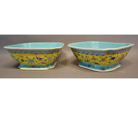 A Pair of 19th Century Chinese Pedestal Dishes of square form, each decorated in polychrome enamels upon a yellow and pale bl