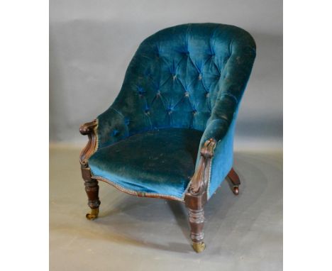 A Victorian Mahogany Drawing Room Chair, the button upholstered back above a stuff over seat with carved scroll arms and turn