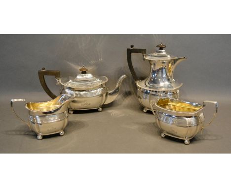 A George V Four Piece Silver Tea Service comprising teapot, hot water pot, two handled sucrier and cream jug, London 1919 and