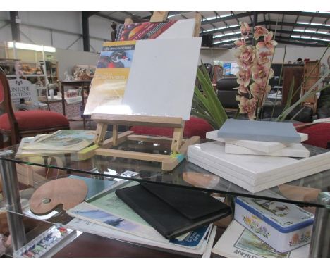 A good lot of artists items, including easel, pallette, acrylic paints, sketch books, vintage paint books and portfoloio with