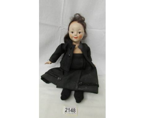 A vintage doll in black costume, 36 cm, a/f.