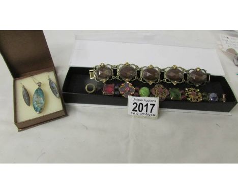 An abalone shell matching pendant and earrings in silver together with two vintage bracelets.