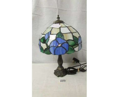 A table lamp with Tiffany style shade.