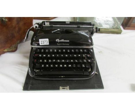 A superb vintage Optima (Made in Germany) portable typewriter in case.  In absolute mint condition.