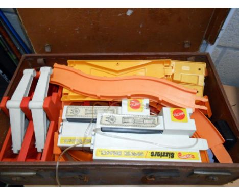 An old suitcase containing Mattel hot wheels track (no cars)