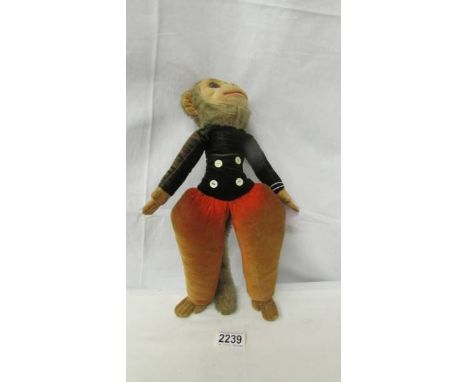 A vintage Norah Welling cloth monkey with original label, 34 cm.