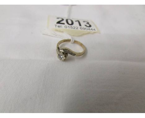 A 9ct gold and diamond ring, size H.