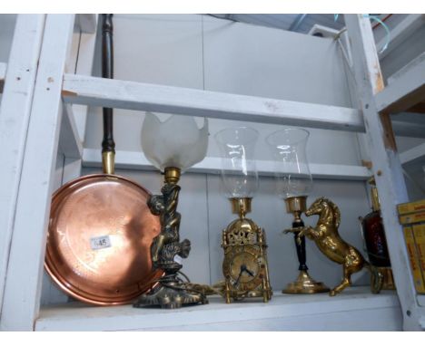 A brass electric clock(needs re-wiring) brass horse, cherub lamp (untested) copper warming pan etc.