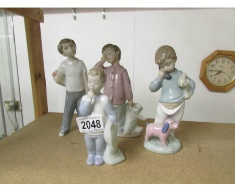 4 NAO by Lladro boy figures.