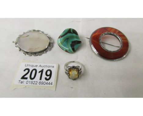 Two 19th century brooches, one set with agate, the other hardstone set, a  yellow stone ring in the art deco style and a furt