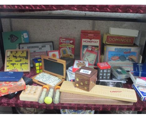 A good lot of games etc. dominoes, cards, autobridge, cribbage boards  etc.