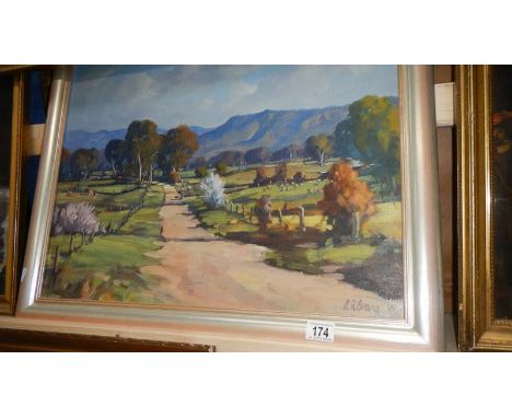A mid 20th century oil on board country lane scene signed L R Evans.